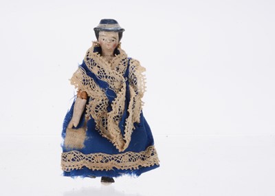 Lot 929 - A mid 19th century German ‘alien head’ dolls’ house doll