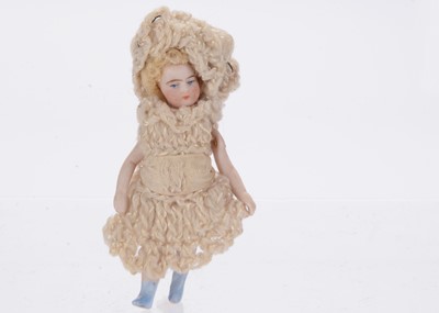 Lot 930 - An all-bisque Lilliputian dolls’ house doll