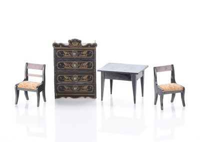 Lot 936 - A German Waltershausen type dolls’ house chest of drawers