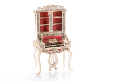 Lot 943 - A 19th century bone doll’s house pianola cabinet