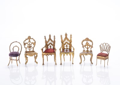 Lot 961 - Brass and gold painted cast metal miniature chairs