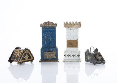Lot 962 - Two German dolls’ house painted tinplate Continental style room stoves