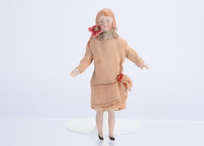 Lot 990 - A 1920s German dolls’ house bisque shoulder-head woman doll
