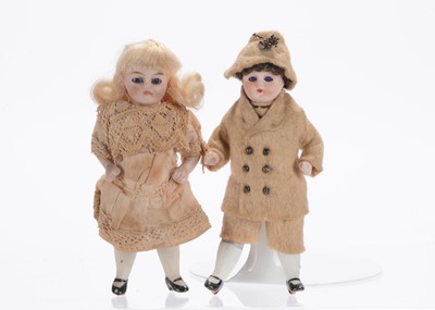 Lot 1009 - Two German all-bisque dolls’ house dolls