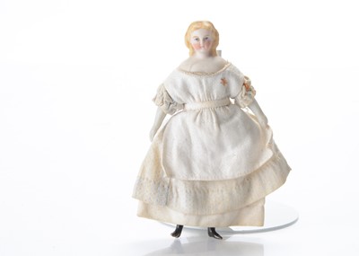 Lot 1029 - An 19th century German bisque shoulder-head dolls’ house doll