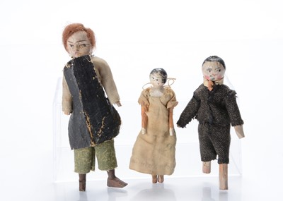 Lot 1033 - Three primitive dolls’ house dolls