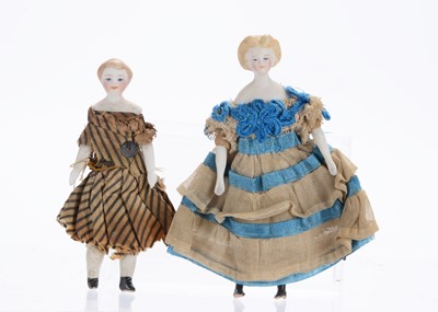 Lot 1034 - Two 19th century German bisque shoulder-head dolls’ house dolls
