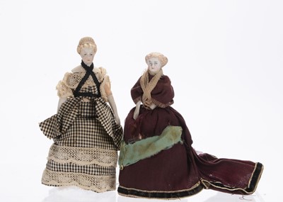 Lot 1036 - Two 19th century German bisque shoulder-head dolls’ house dolls