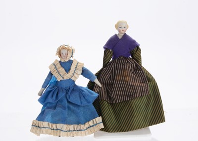 Lot 1037 - Two 19th century German bisque shoulder-head dolls’ house dolls