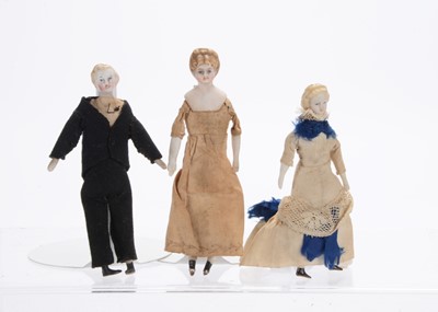 Lot 1038 - Three 19th century German bisque shoulder-head dolls’ house dolls