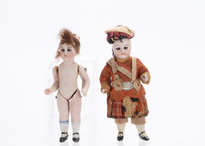 Lot 1040 - Two German all-bisque dolls’ house dolls