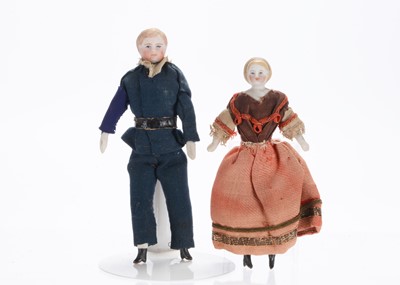 Lot 1042 - Two 19th century German bisque shoulder-head dolls’ house dolls