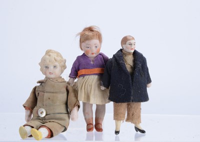 Lot 1047 - Three dolls’ house dolls