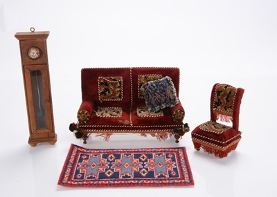 Lot 1055 - A German larger scale dolls’ house sofa and chair