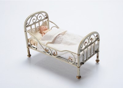 Lot 1057 - A Märklin painted tinplate dolls’ house bed