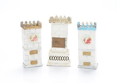 Lot 1058 - German tinplate dolls’ house Continental style room stoves