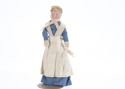 Lot 1066 - A German bisque shoulder-head dolls’ house maid