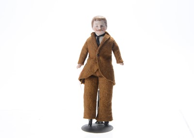 Lot 1067 - A German bisque shoulder-head dolls’ house male doll