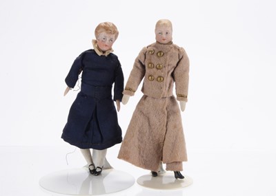 Lot 1070 - A late 19th century German bisque shoulder-head dolls’ house male doll