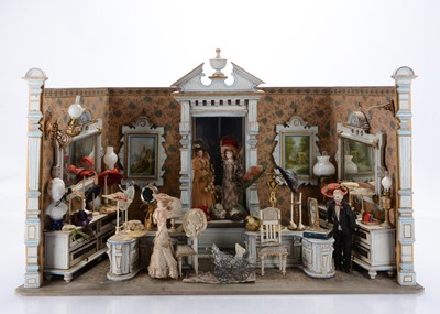 Lot 1080 - A rare late 19th century Gottschalk wooden dolls’ house room millinery shop