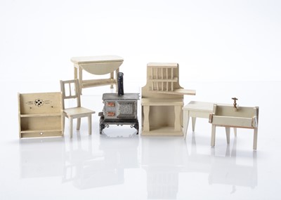 Lot 1088 - A German cast-metal cooking stove and Gottschalk dolls’ house wooden furniture