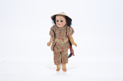 Lot 1121 - A German bisque headed Asian dolls’ house doll