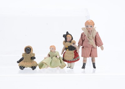Lot 1122 - Three Horn all-bisque dolls’ house dolls