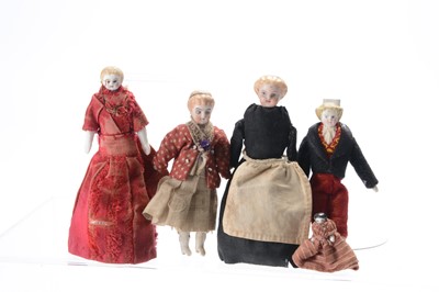 Lot 1127 - Four German bisque shoulder-head dolls’ house dolls