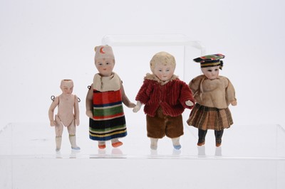 Lot 1128 - Three German all-bisque dolls’ house dolls