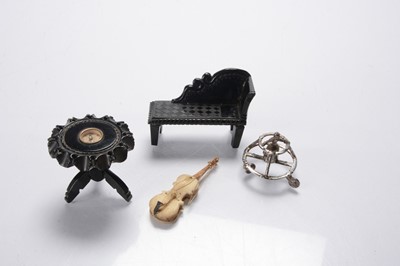Lot 1138 - A continental silver dolls’ house baby in walker