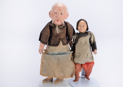 Lot 1238 - Two papier-mâché headed Chinese elderly dolls