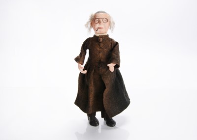 Lot 1240 - A 1920-30s Continental composition headed priest squeak toy doll