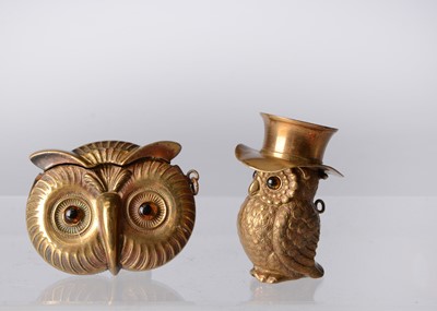 Lot 1255 - Two late 19th century brass owl vesta cases