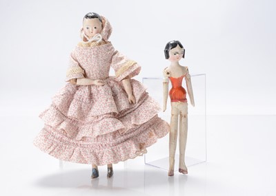 Lot 1287 - An interesting 19th century composition headed doll with jointed wooden body