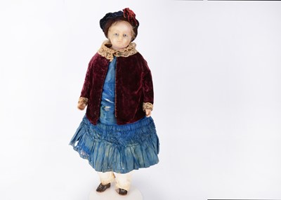 Lot 1334 - A mid 19th century English poured wax child doll
