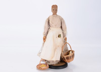 Lot 1337 - An interesting carved wooden jointed black women doll