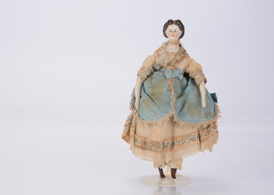 Lot 1338 - A small mid 19th century German bisque shoulder-head doll