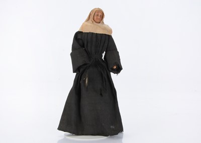 Lot 1340 - An early poured bees wax nun doll
