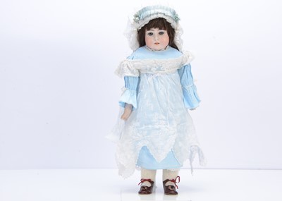 Lot 1357 - A late 19th century German bisque head turned doll