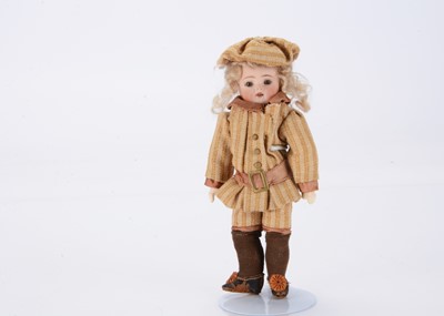 Lot 1373 - A small German bisque headed boy doll marked 204