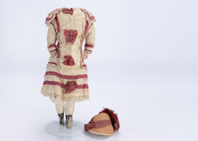 Lot 1423 - A well-dressed wax over composition doll's body