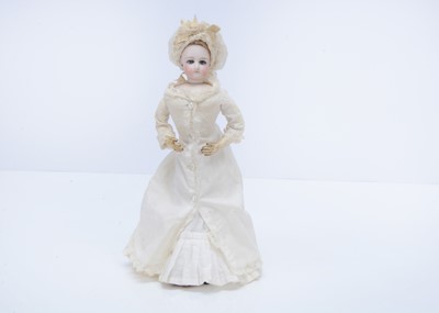 Lot 1435 - A small French swivel head fashion doll