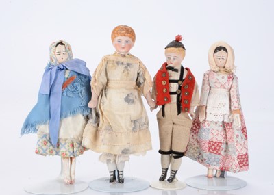 Lot 1438 - Four small dolls or large scale dolls’ house dolls