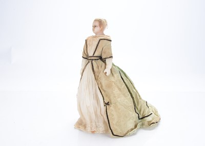 Lot 1442 - A mid 19th century English poured wax shoulder-head doll
