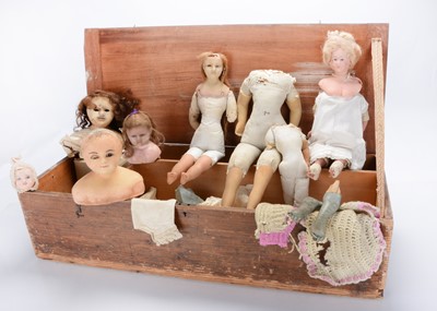 Lot 1444 - A wooden box of wax dolls for repair