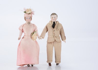 Lot 1473 - A German Edwardian bisque shoulder-head dolls’ house couple