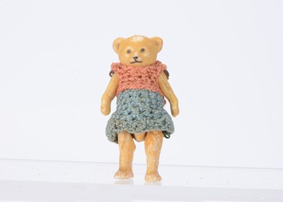 Lot 1479 - A Hertwig all-bisque girl teddy bear dolls’ house doll