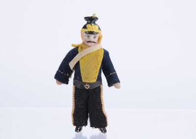 Lot 1508 - A late 19th all-bisque dolls’ house soldier doll