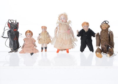 Lot 1515 - An all-bisque Lilliputian dolls’ house doll