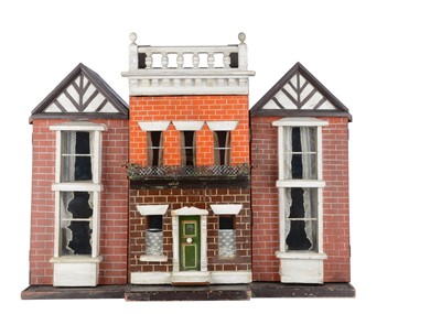 Lot 1536 - An unusual late 19th century English wooden box back dolls’ house with later wings